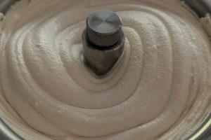 churning blood orange ice cream in a lello 4080 ice cream maker.