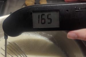 an instant-read thermometer reads "165°F".