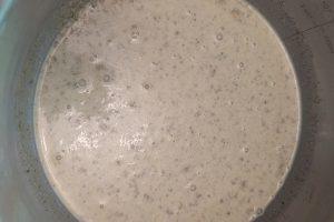 pistachio ice cream base in a stainless steel bowl.