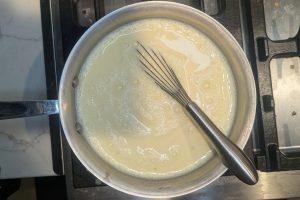 ice cream base in a saucepan after adding tempered egg yolks.