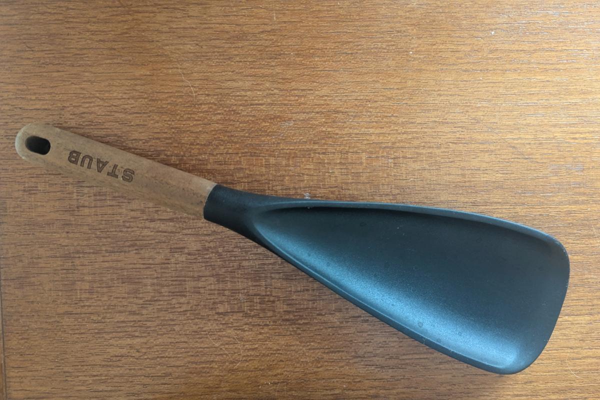 Staub rubber spatula with wooden handle for packing ice cream pints.
