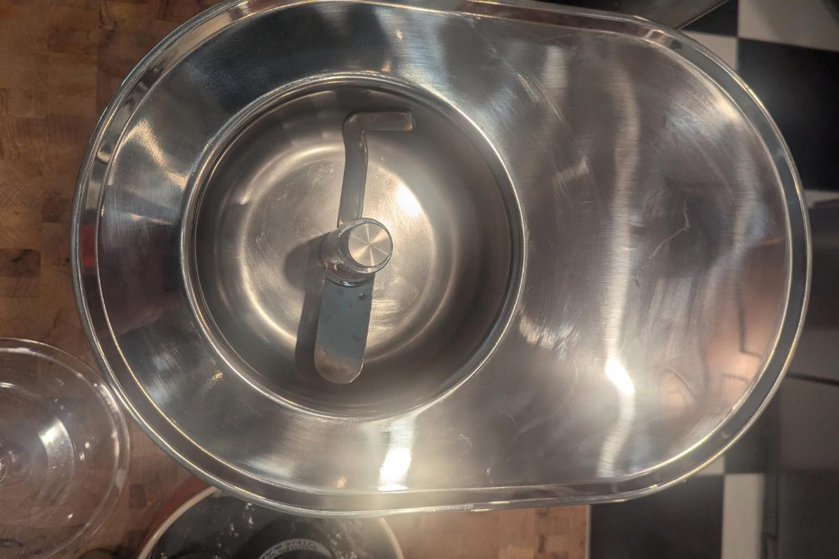 overhead view of an empty, clean lello 4080 musso lussino ice cream maker with the dasher and nut in place.