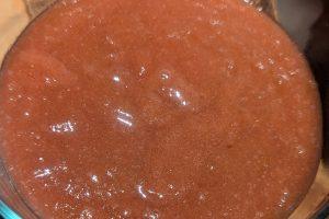 closeup of freshly-made rhubarb jam in a bowl.