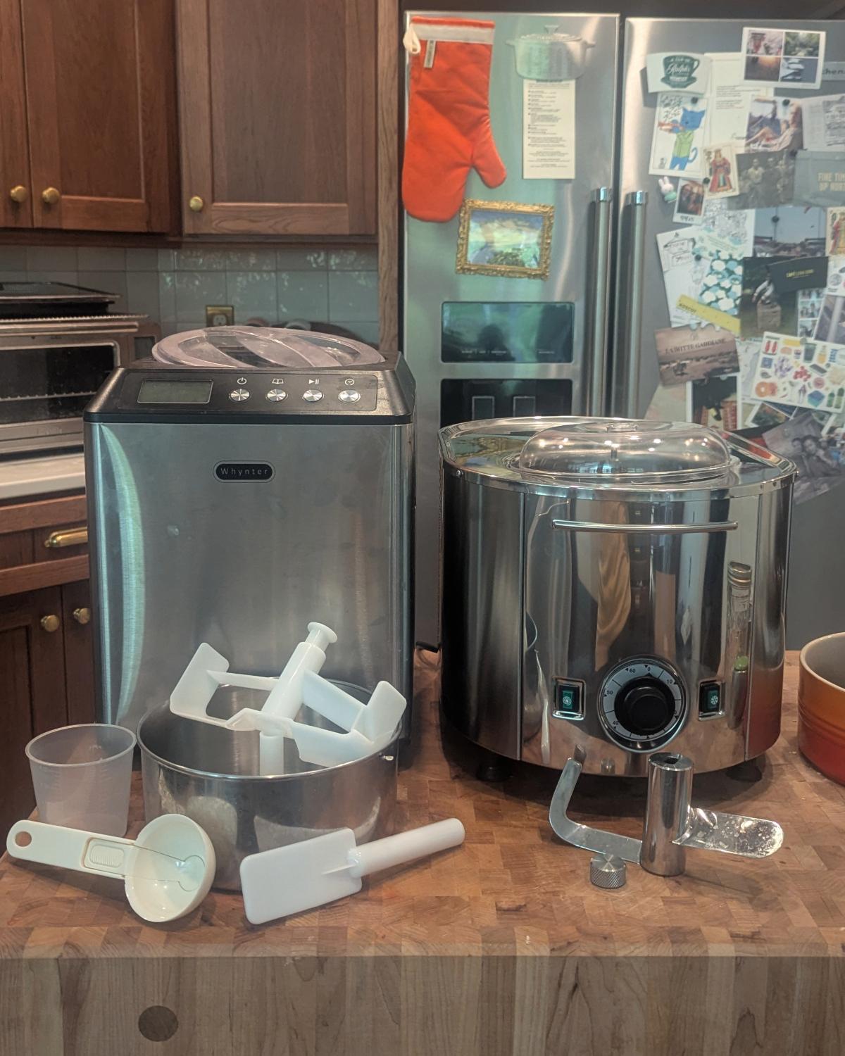 a whynter icm-201sb and a lello 4080 musso lussino next to each other on a butcher block with all their included attachments shown.