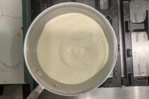 granulated sugar, skim milk powder, and guar gum whisked together in a saucepan.