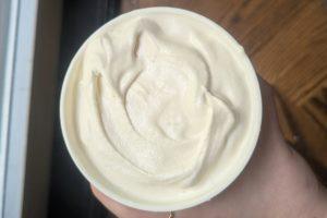 freshly churned philadelphia style ice cream in a pint container.