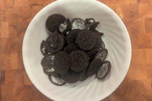 Oreo cookie halves with the cream removed in a bowl.