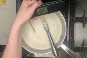 coffee custard ice cream base in a saucepan heated to 165°F.