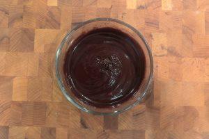 silky chocolate ganache in a small bowl.