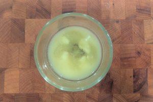 melted butter and avocado oil in a small glass bowl.