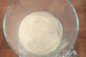 sugar, skim milk powder, and guar gum in a glass container.