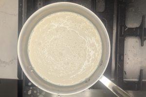 coffee ice cream base in a saucepan.