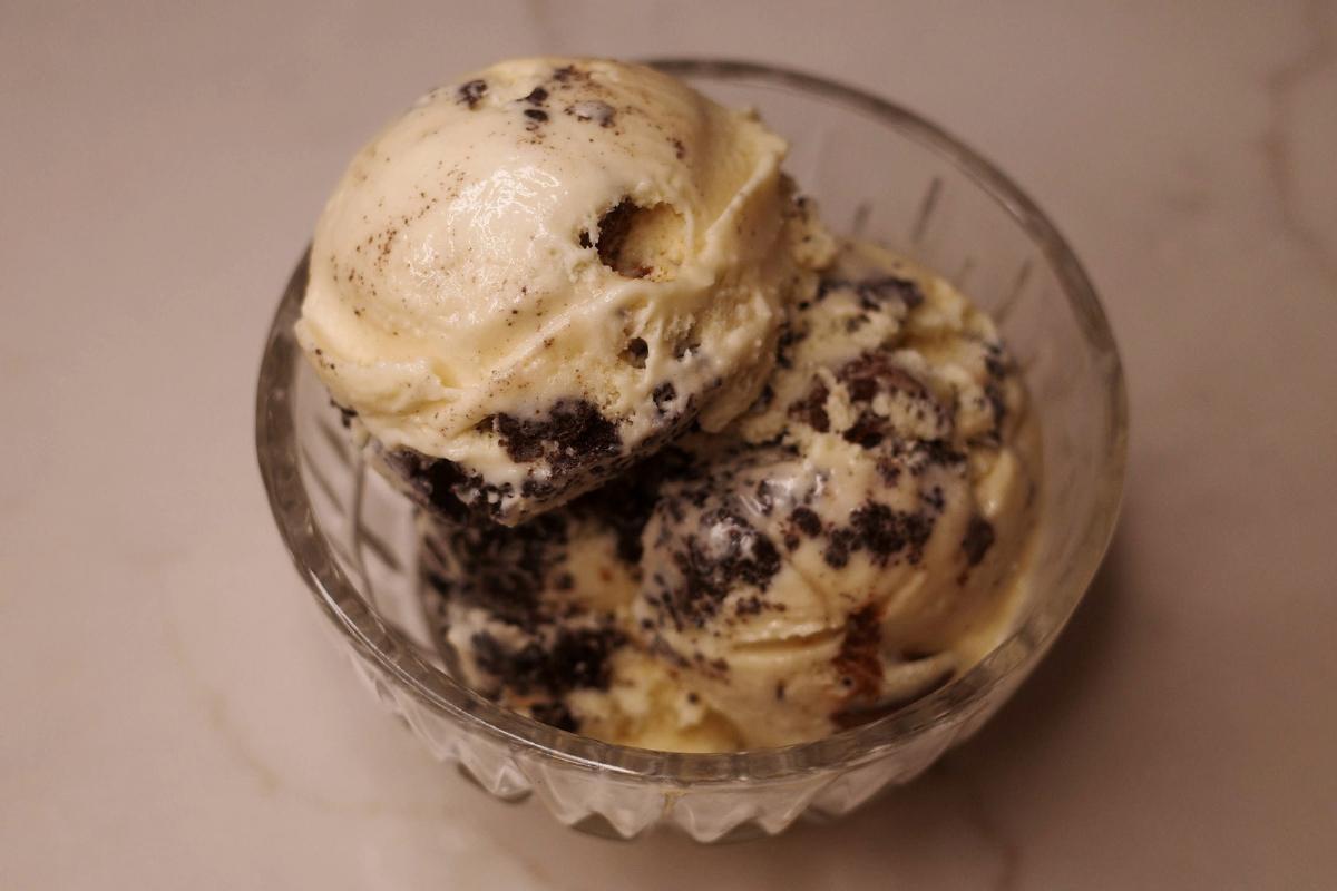 three-quarters view of scoops of copycat vermonty python ice cream in a glass dish.