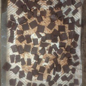 overhead view of fudge chunks for ice cream on a baking tray.